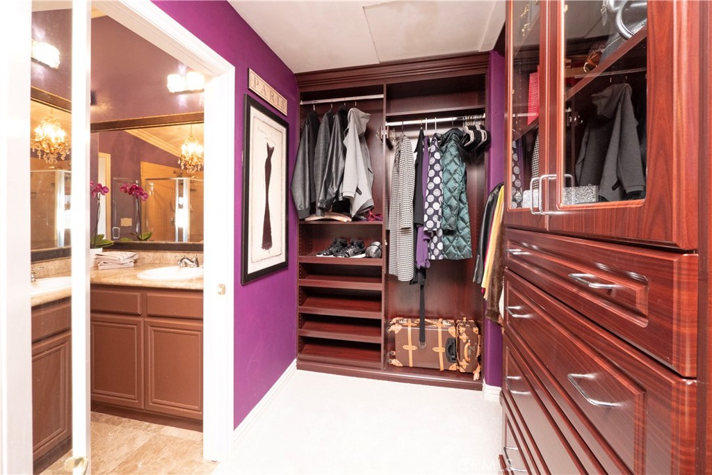 20642 Iris Canyon Road Riverside, CA 92508 - Photo 37 of 57 a view of walk in closet with clothes and shoes