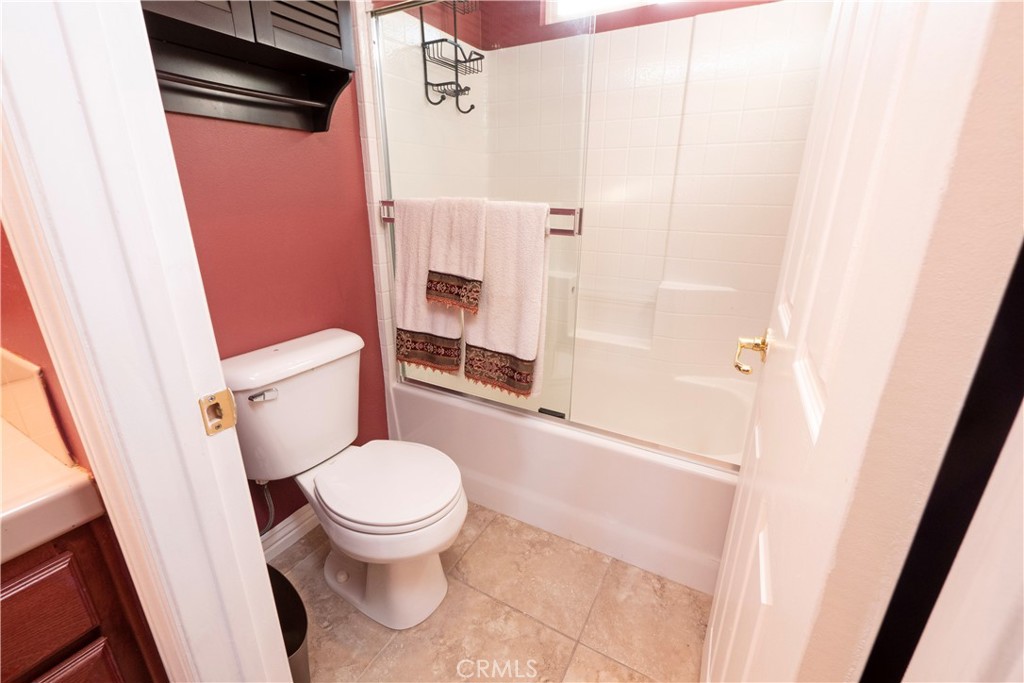 20642 Iris Canyon Road Riverside, CA 92508 - Photo 41 of 57 a white toilet sitting next to a small sink