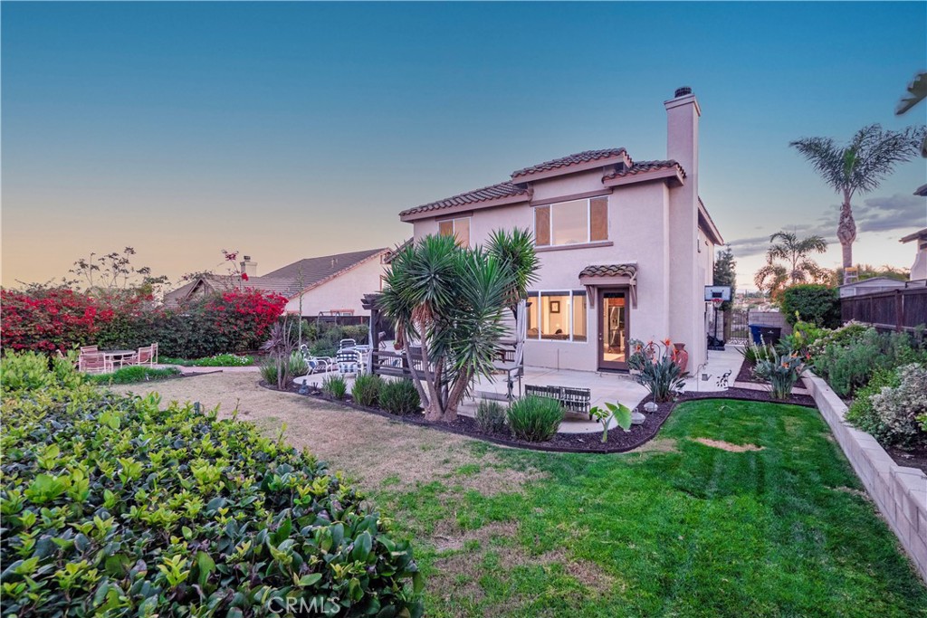 20642 Iris Canyon Road Riverside, CA 92508 - Photo 50 of 57 a view of a house with a backyard and a garden