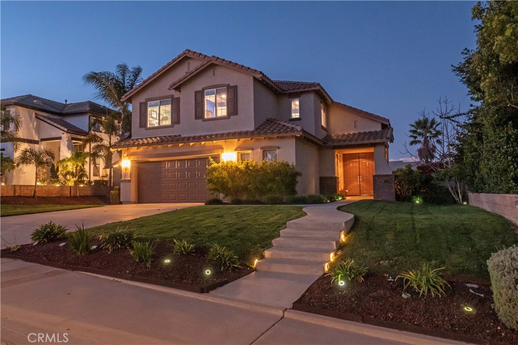 20642 Iris Canyon Road Riverside, CA 92508 - Photo 51 of 57 a front view of a house with a yard and garage