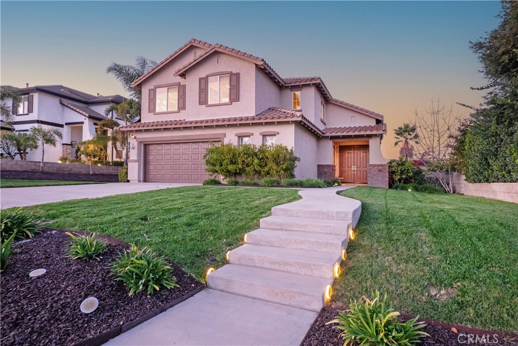 20642 Iris Canyon Road Riverside, CA 92508 - Photo 52 of 57 a front view of a house with a yard and garage