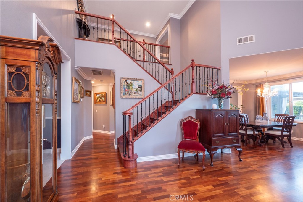 20642 Iris Canyon Road Riverside, CA 92508 - Photo 9 of 57 a view of entryway dining room and hall with wooden floor