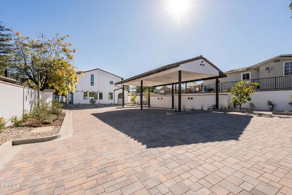 a view of a house with snow on the road