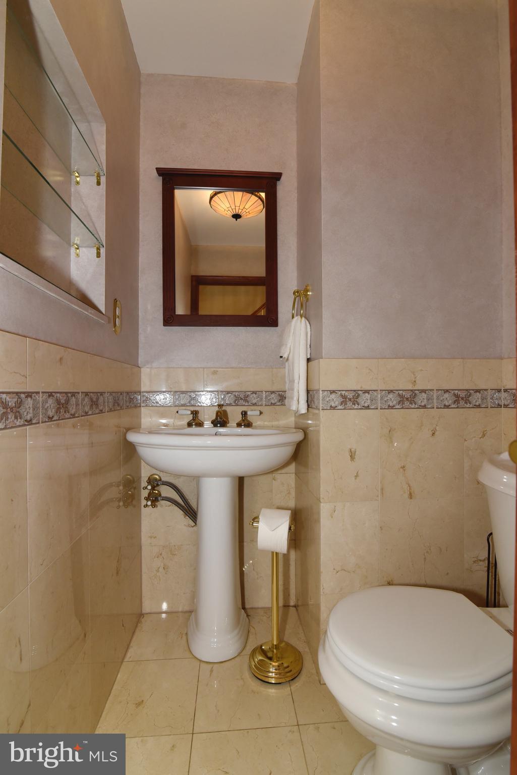 2208 Spinnaker Court Reston, VA 20191 - Photo 23 of 39 a bathroom with a toilet sink and mirror