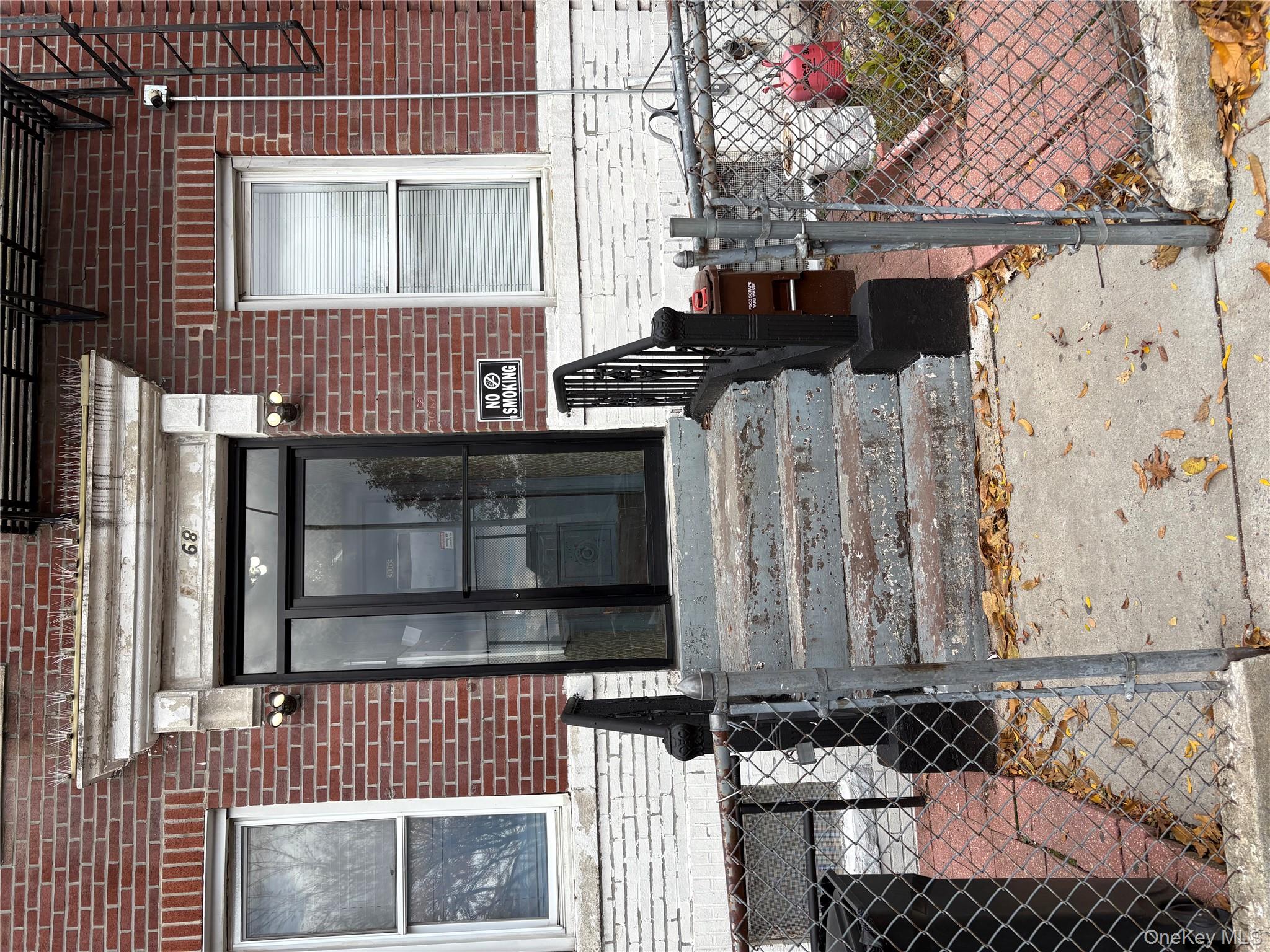 30-68 45th Street, Unit 1 Queens, NY 11103 - Photo 1 of 24 a front view of a house with a yard