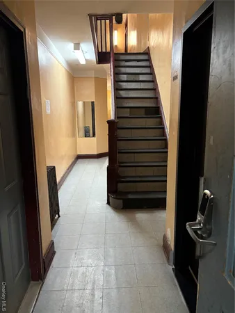 a view of a hallway with entryway and closet