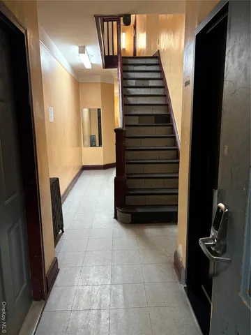 a view of a hallway with entryway and closet