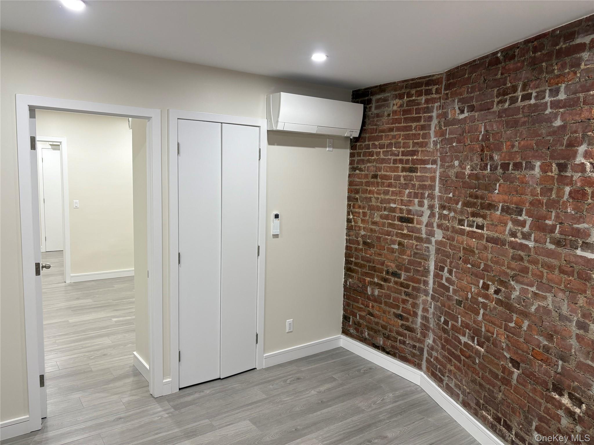 30-68 45th Street, Unit 1 Queens, NY 11103 - Photo 4 of 24 a view of an empty room with wooden floor