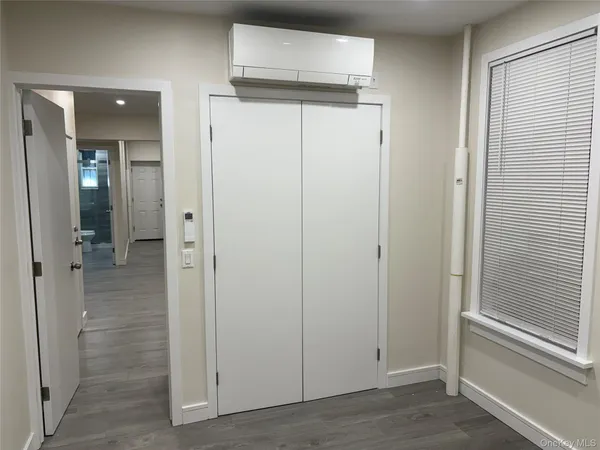 wooden view of a bathroom from the hallway