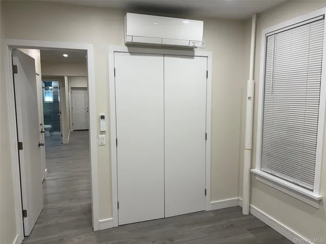 wooden view of a bathroom from the hallway