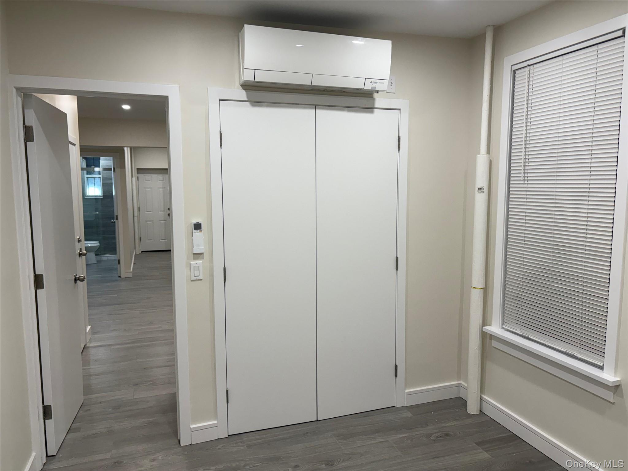 30-68 45th Street, Unit 1 Queens, NY 11103 - Photo 7 of 24 wooden view of a bathroom from the hallway
