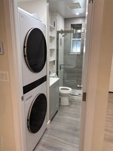 a view of a hallway with washer and dryer