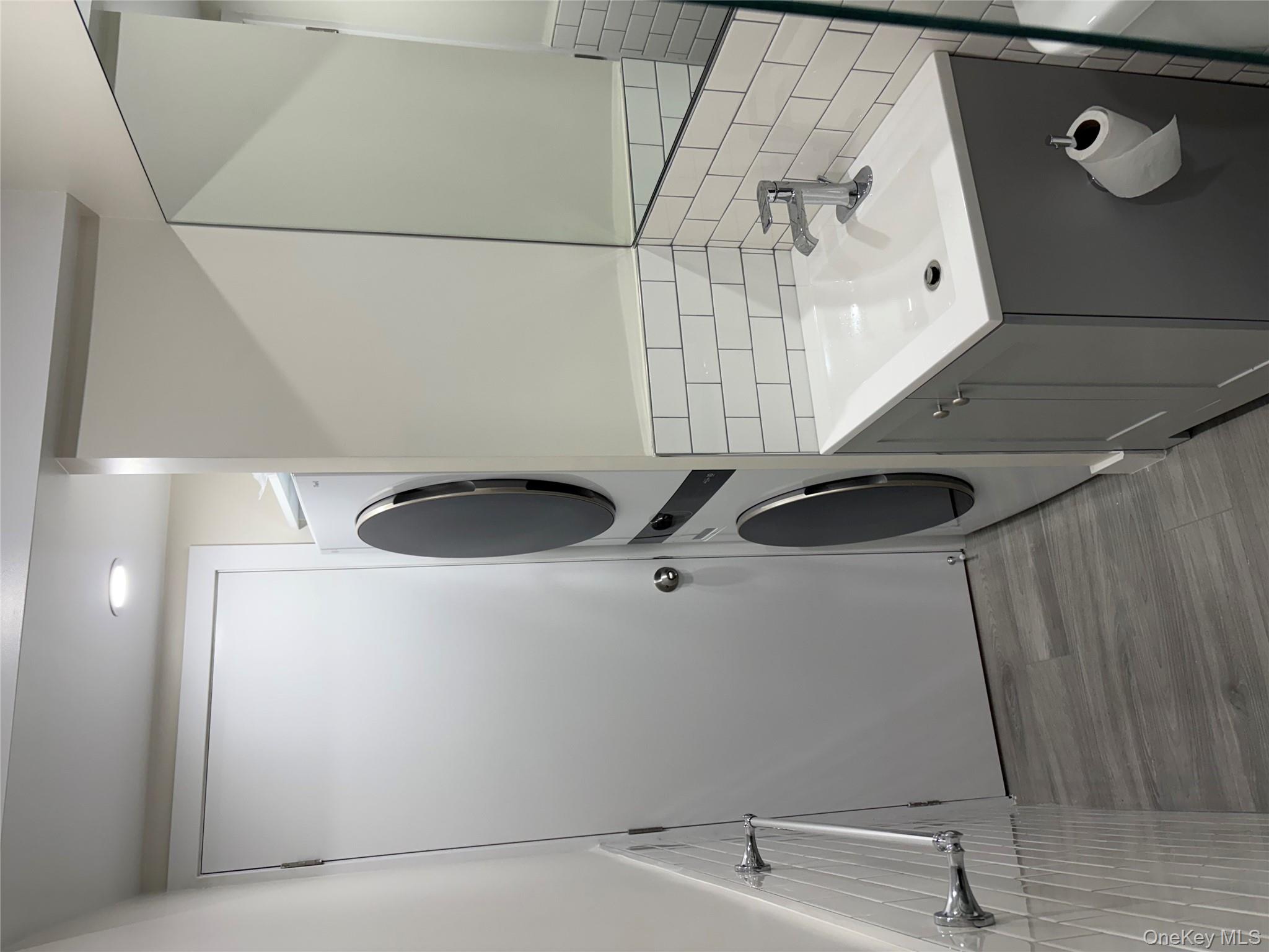 30-68 45th Street, Unit 1 Queens, NY 11103 - Photo 10 of 24 a bathroom with a sink and a mirror