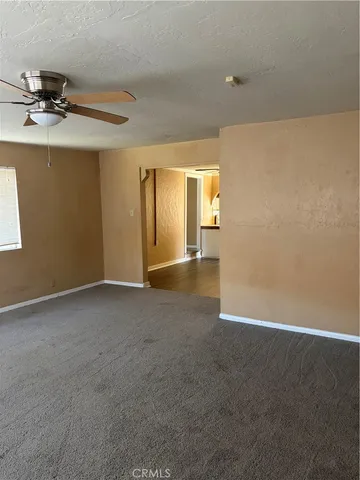 a kitchen with a sink cabinets and wooden floor