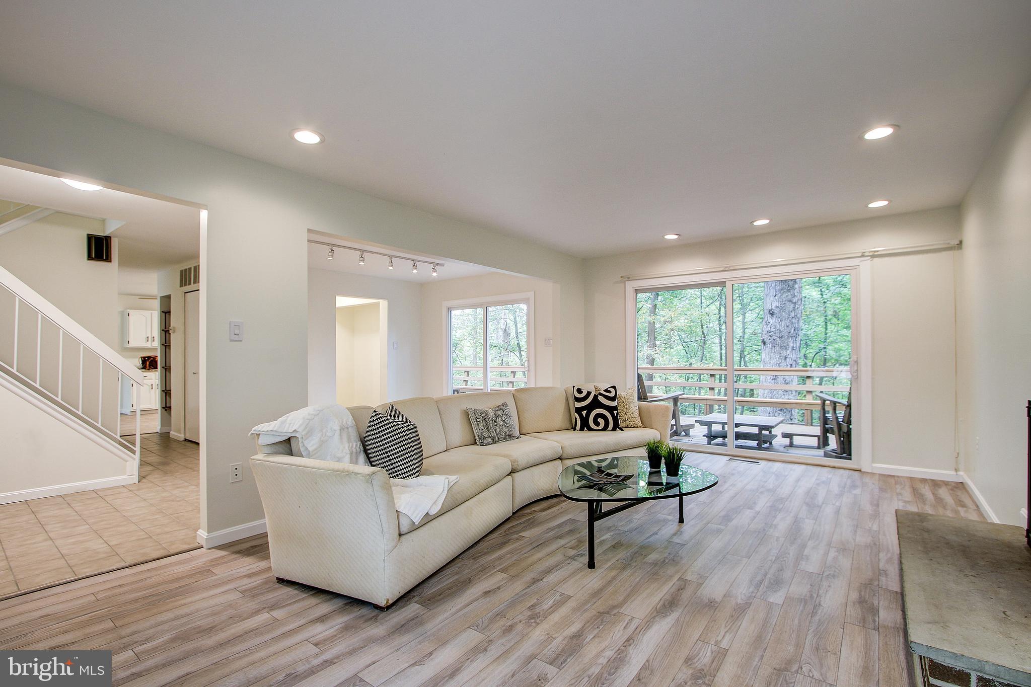14817 Stonegate Terrace Silver Spring, MD 20905 - Photo 4 of 30 Living room leading to deck