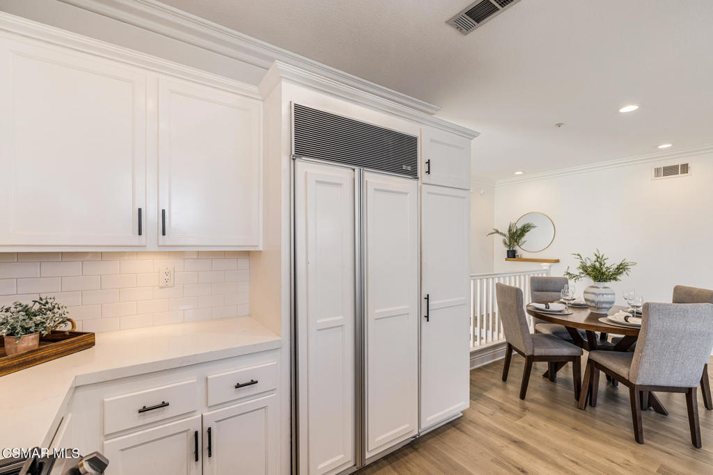 4038 Napoli Place Moorpark, CA 93021 - Photo 14 of 33 a kitchen with stainless steel appliances granite countertop a refrigerator and a stove top oven