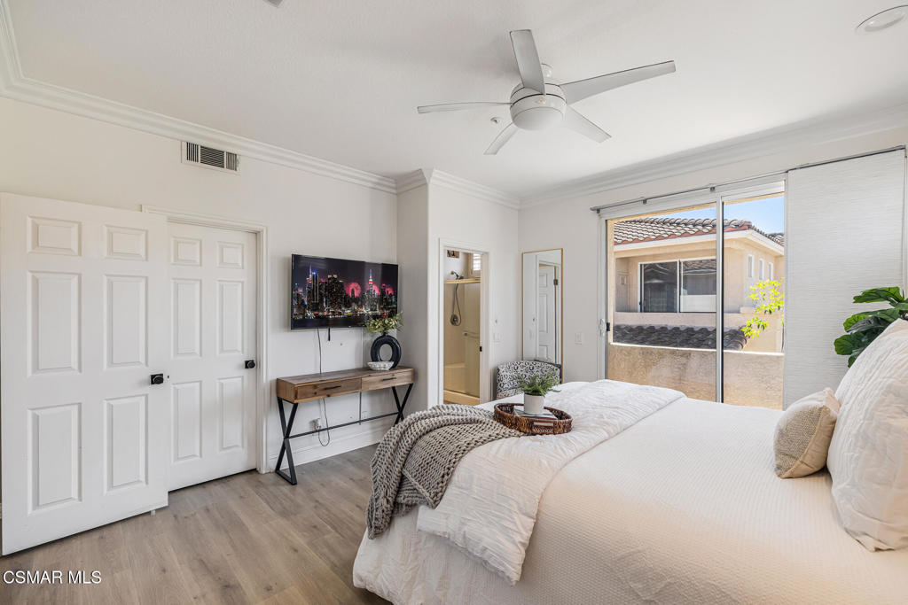 4038 Napoli Place Moorpark, CA 93021 - Photo 19 of 33 a bedroom with a bed and a flat screen tv