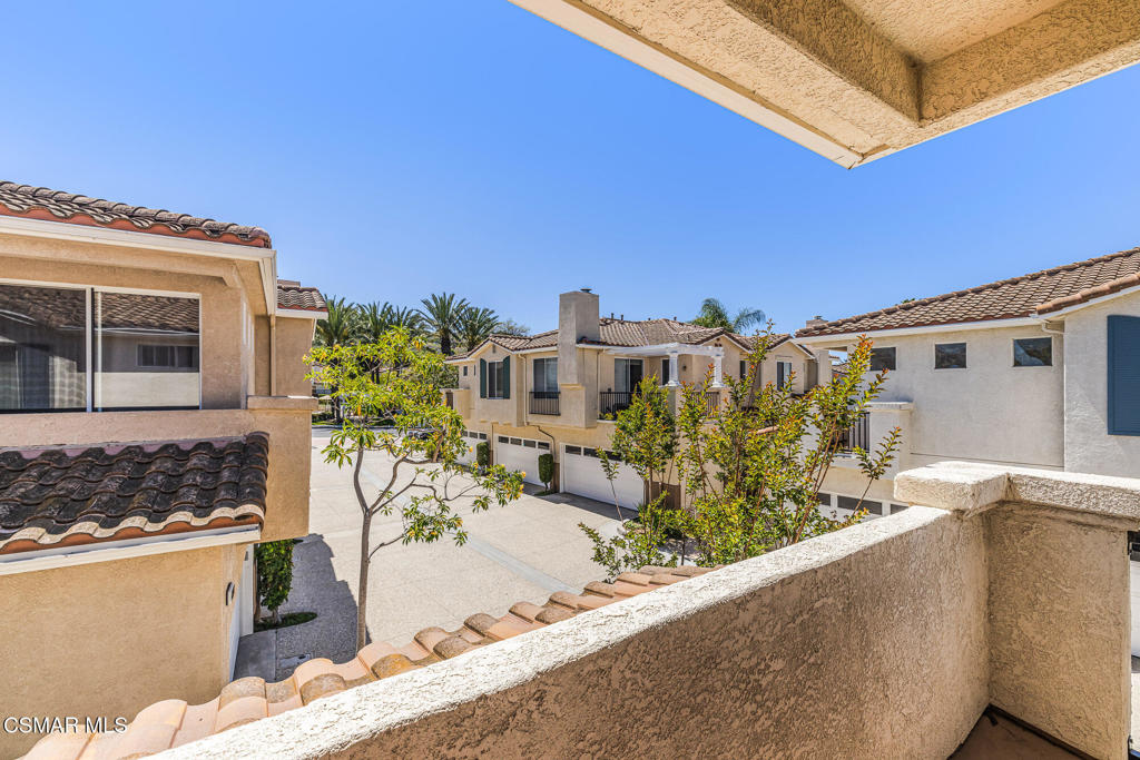 4038 Napoli Place Moorpark, CA 93021 - Photo 24 of 33 a view of roof deck with wooden fence and a couch