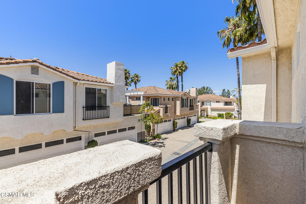 4038 Napoli Place Moorpark, CA 93021 - Photo 25 of 33 a table and chairs in a balcony
