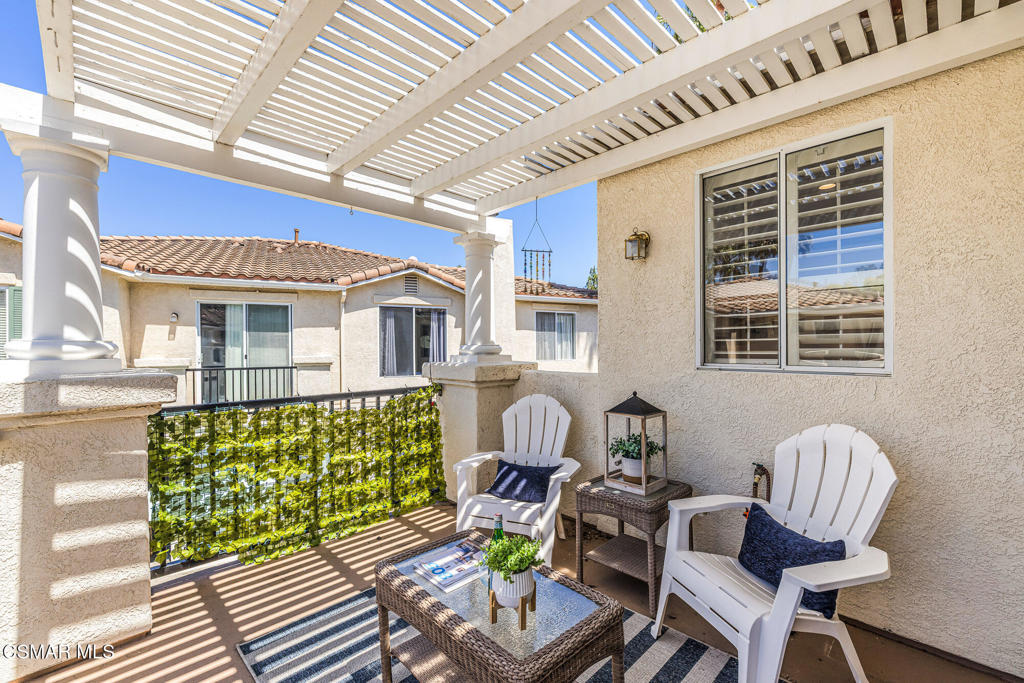 4038 Napoli Place Moorpark, CA 93021 - Photo 27 of 33 a front view of a house with outdoor seating