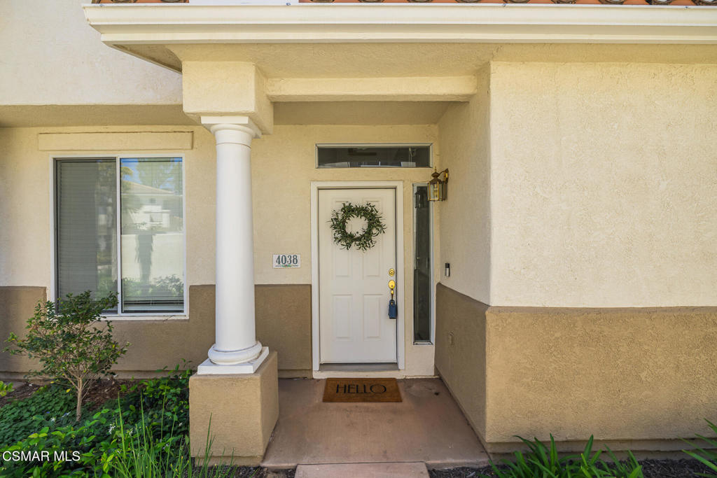 4038 Napoli Place Moorpark, CA 93021 - Photo 5 of 33 a front view of a house with a garden