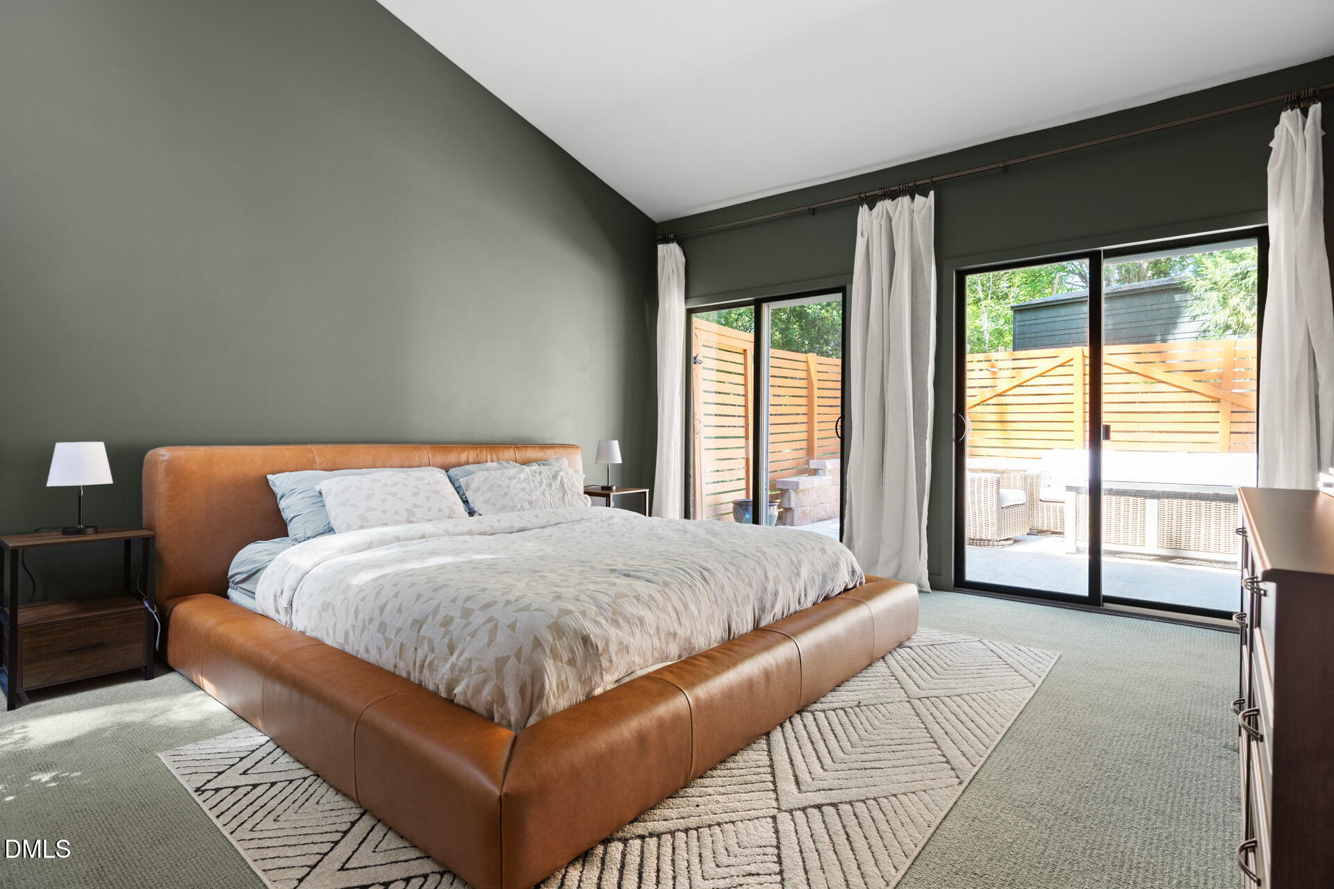 5208 Saddle Court Raleigh, NC 27609 - Photo 24 of 43 a bedroom with a large bed and a large window