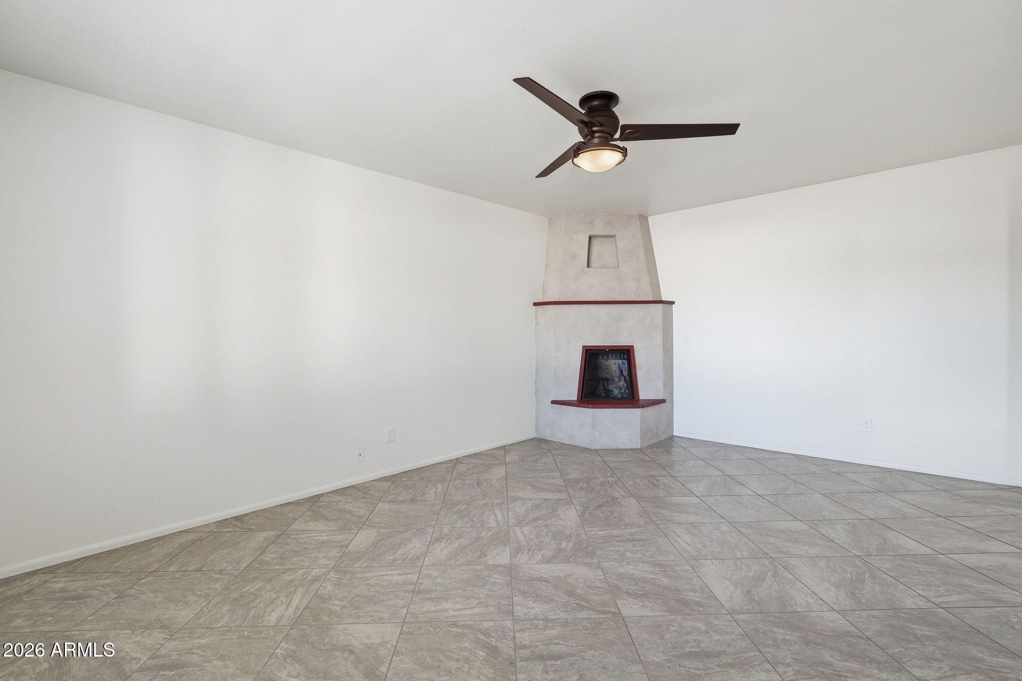 5352 South Country Club Way Tempe, AZ 85283 - Photo 10 of 42 a view of an empty room with a chandelier fan