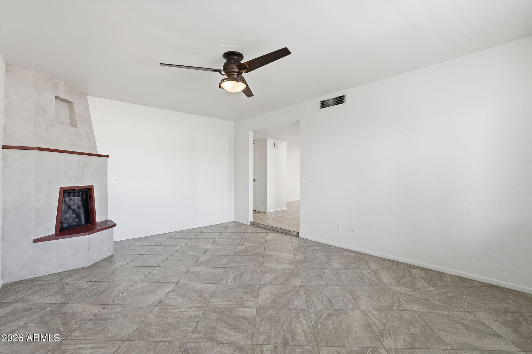 5352 South Country Club Way Tempe, AZ 85283 - Photo 11 of 42 a view of a livingroom with a ceiling fan and window
