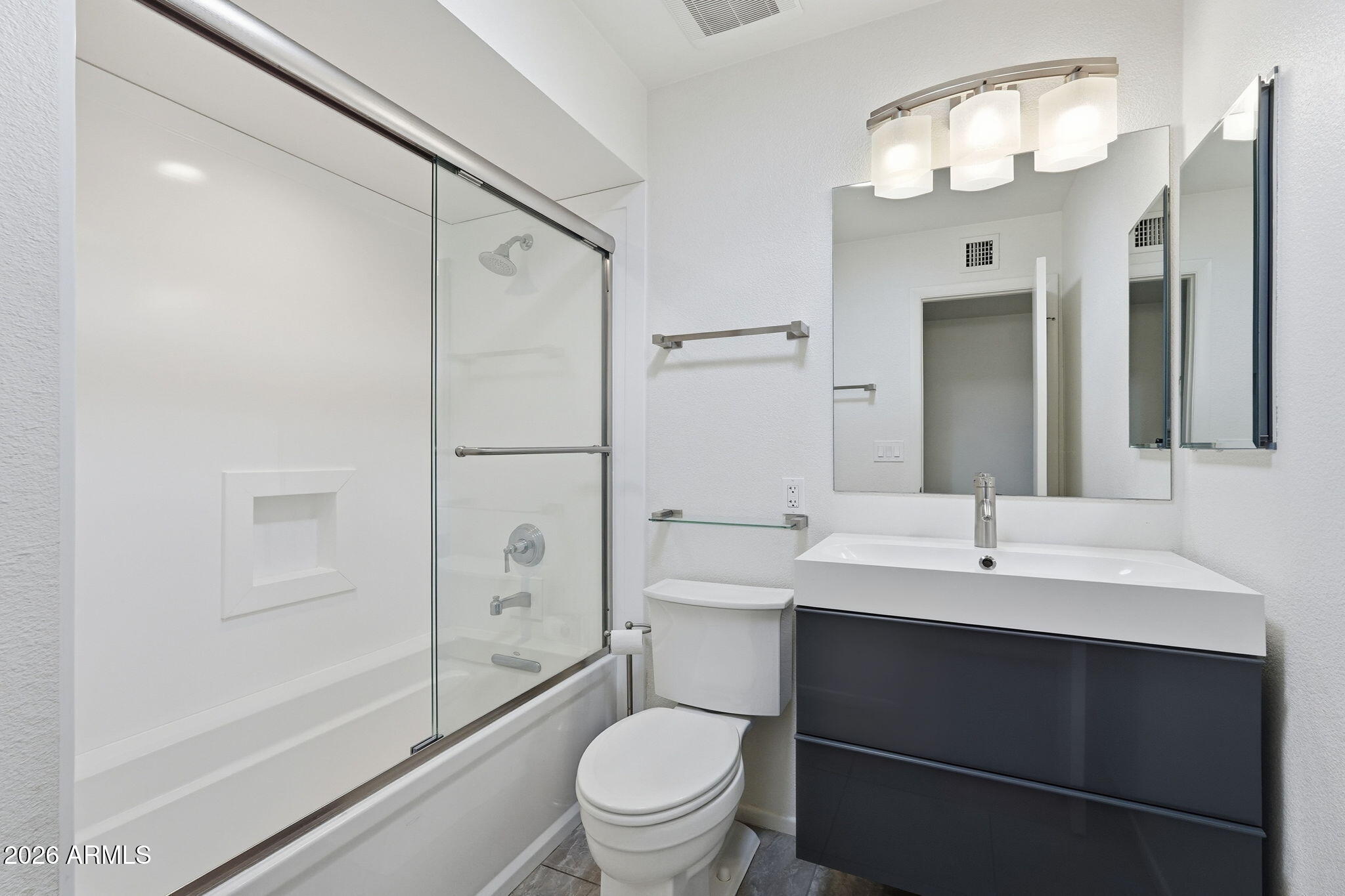 5352 South Country Club Way Tempe, AZ 85283 - Photo 12 of 42 a bathroom with a sink a toilet and shower