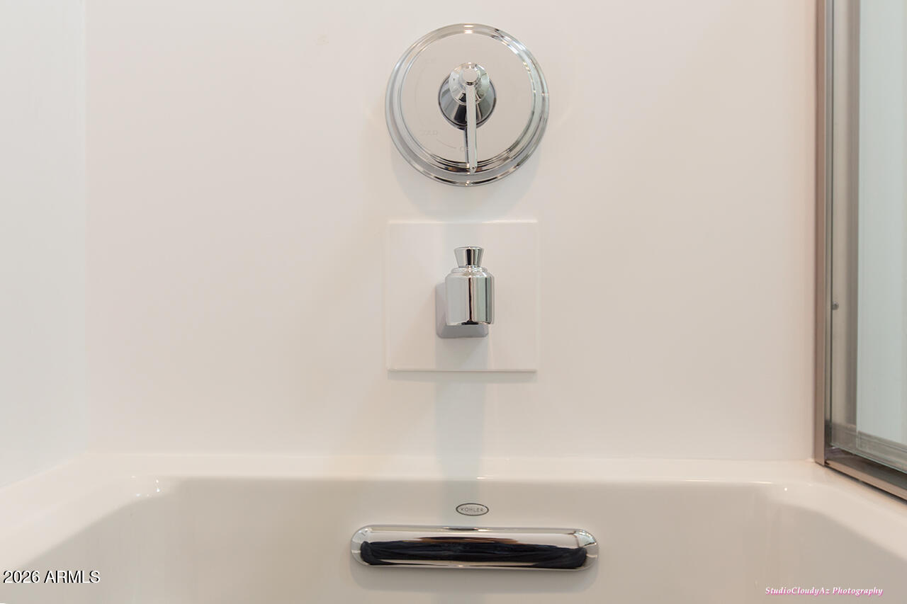 5352 South Country Club Way Tempe, AZ 85283 - Photo 13 of 42 a bathroom with a sink and a mirror