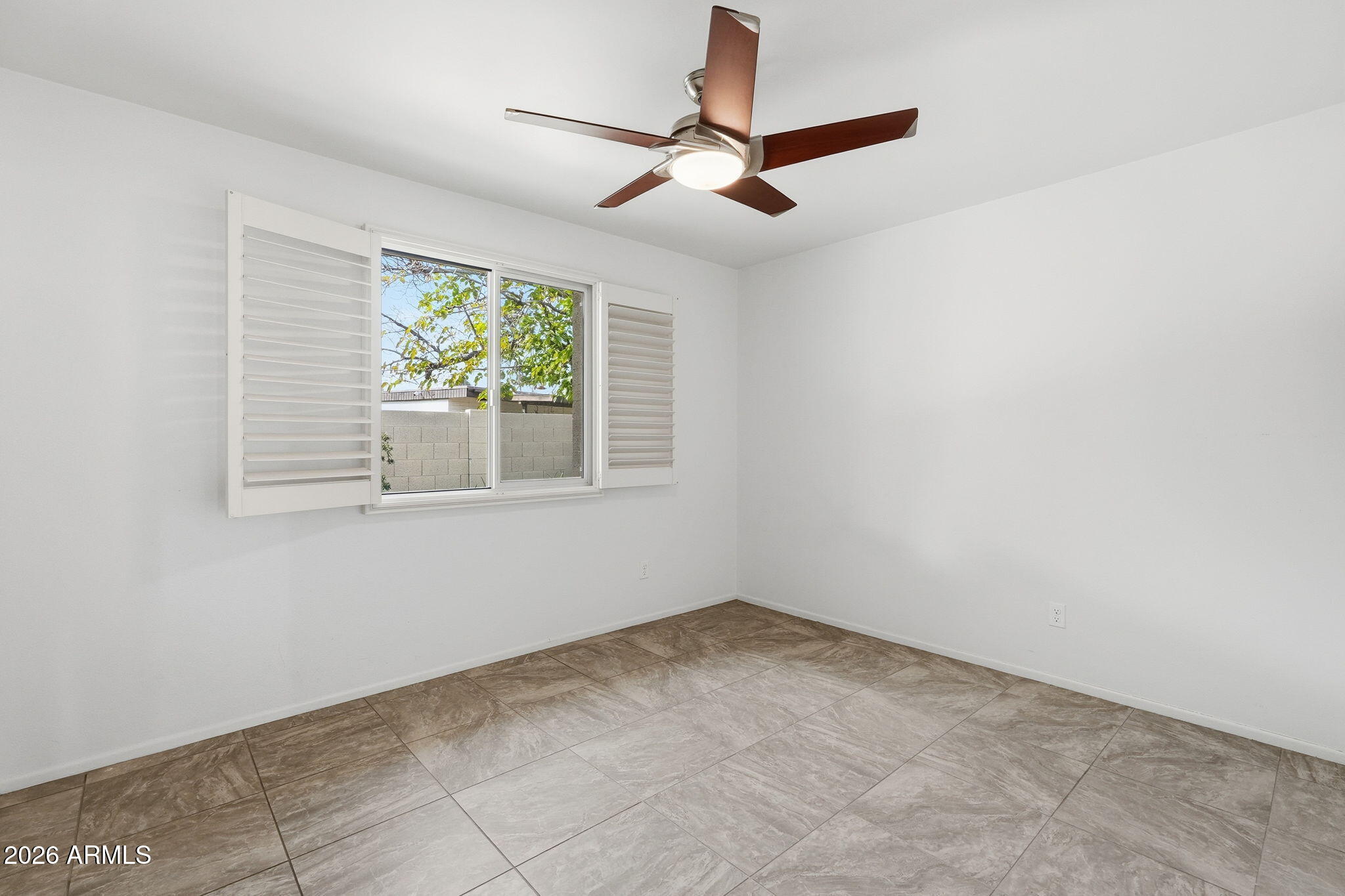 5352 South Country Club Way Tempe, AZ 85283 - Photo 15 of 42 a view of an empty room with a window