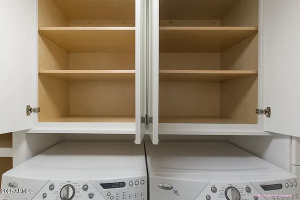 a kitchen with a refrigerator and a sink