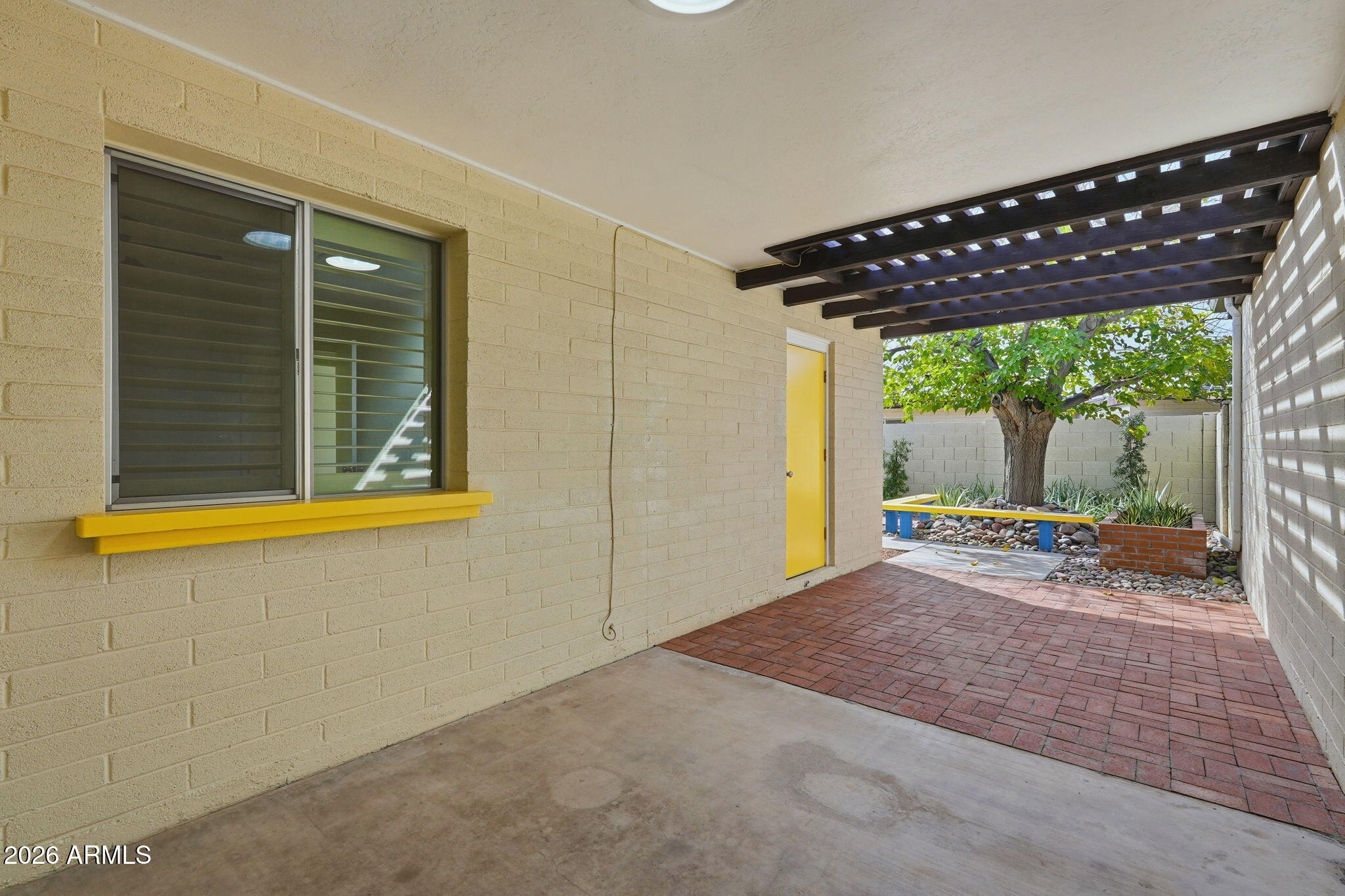 5352 South Country Club Way Tempe, AZ 85283 - Photo 23 of 42 a view of a house with porch and wooden floor