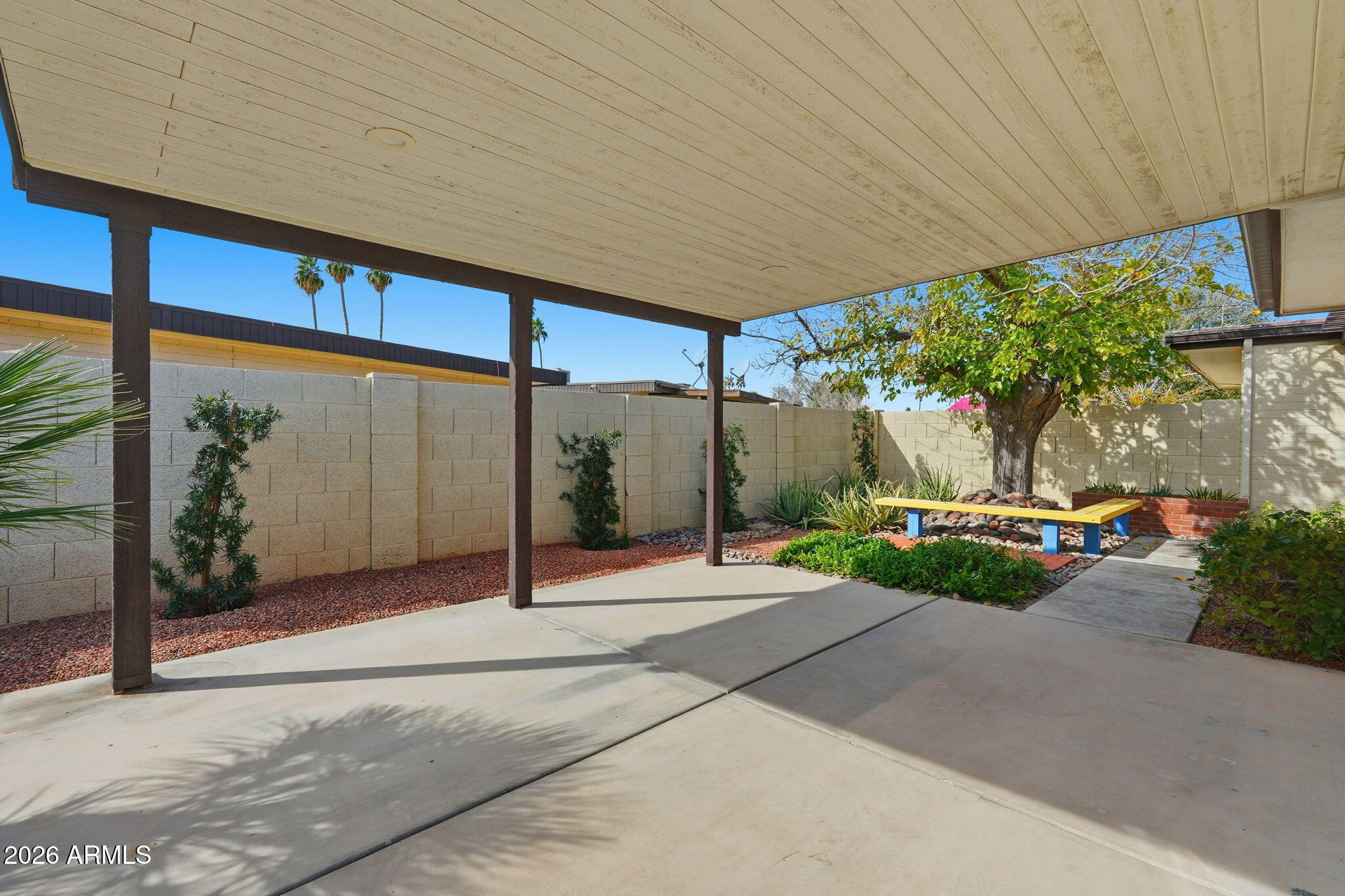 5352 South Country Club Way Tempe, AZ 85283 - Photo 25 of 42 a view of a chair and tables in the patio