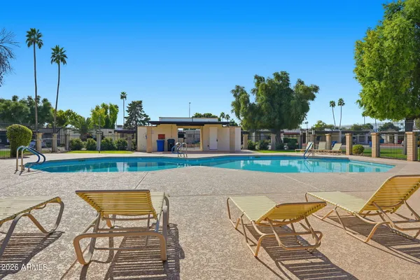 a view of swimming pool with seating space