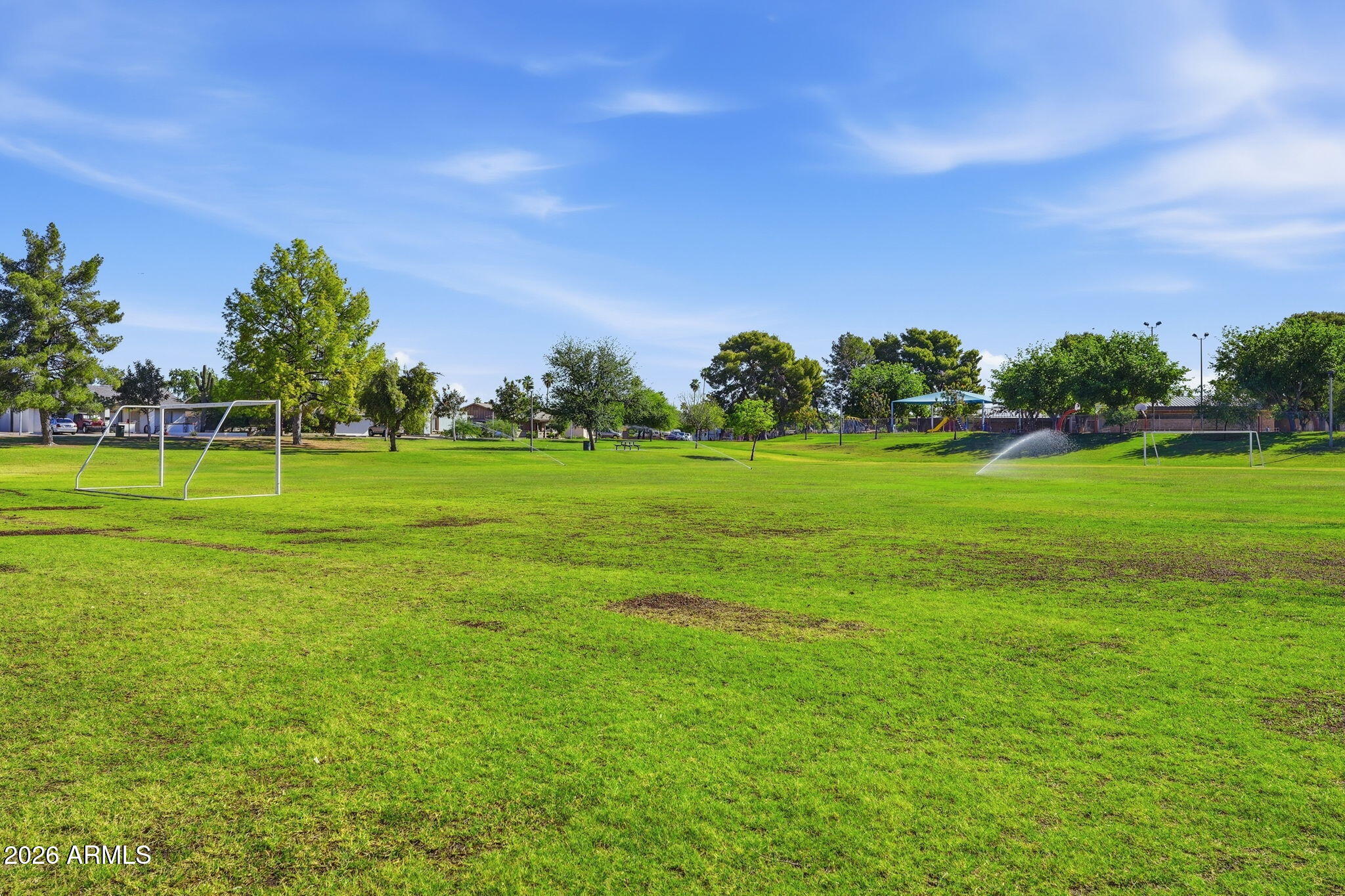 5352 South Country Club Way Tempe, AZ 85283 - Photo 34 of 42 a backyard with a huge green field and trees