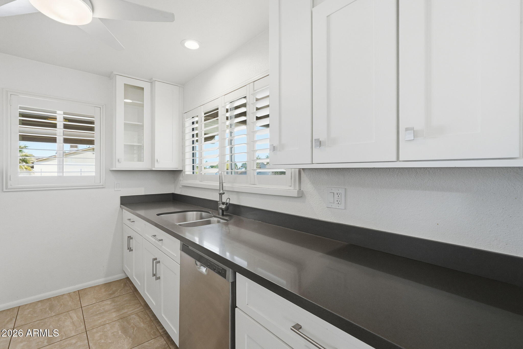 5352 South Country Club Way Tempe, AZ 85283 - Photo 6 of 42 a kitchen with a sink and cabinets