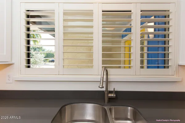 a kitchen with a sink and cabinets