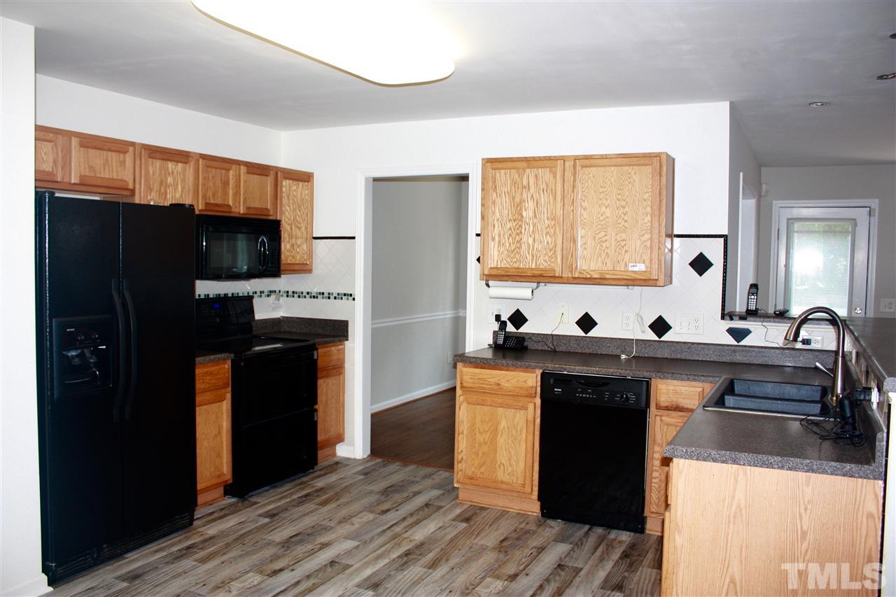 1515 Pebble Ridge Drive Raleigh, NC 27610 - Photo 7 of 17 Open kitchen with new flooring, and all appliances!