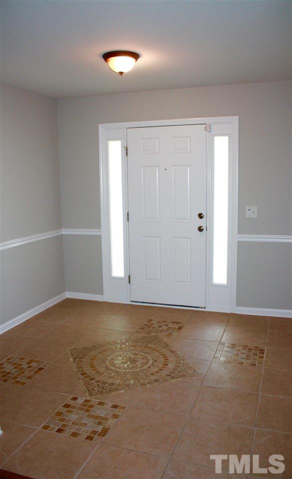 1515 Pebble Ridge Drive Raleigh, NC 27610 - Photo 9 of 17 Custom tile in the large, welcoming foyer