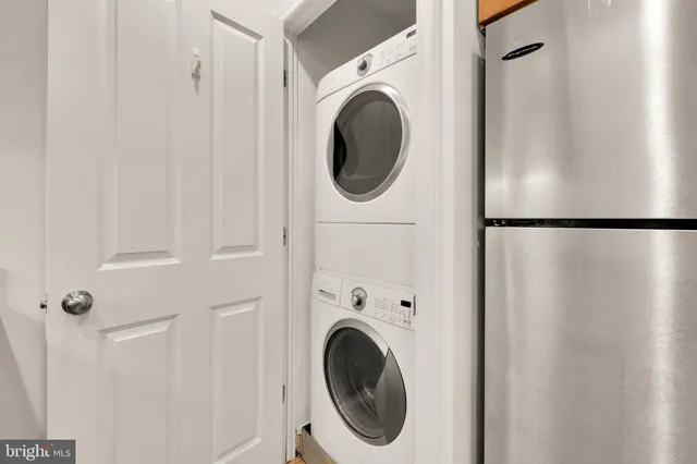 a close view of a utility room with dryer and washer