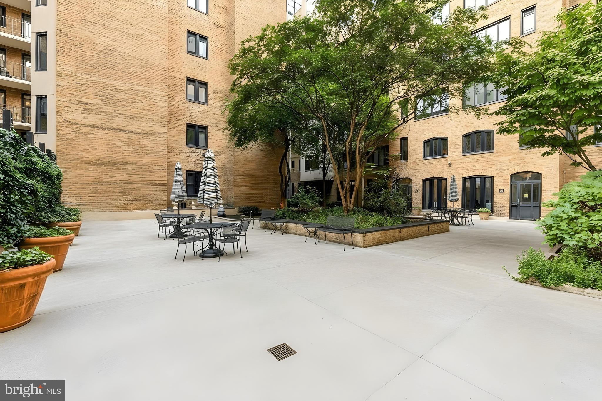 1701 16th Street Northwest, Unit 822 Washington, DC 20009 - Photo 18 of 19 a view of a white house with chairs in patio