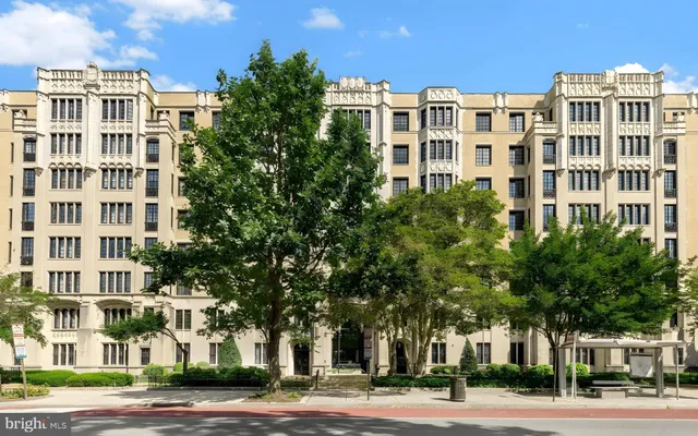 a view of a building with a yard