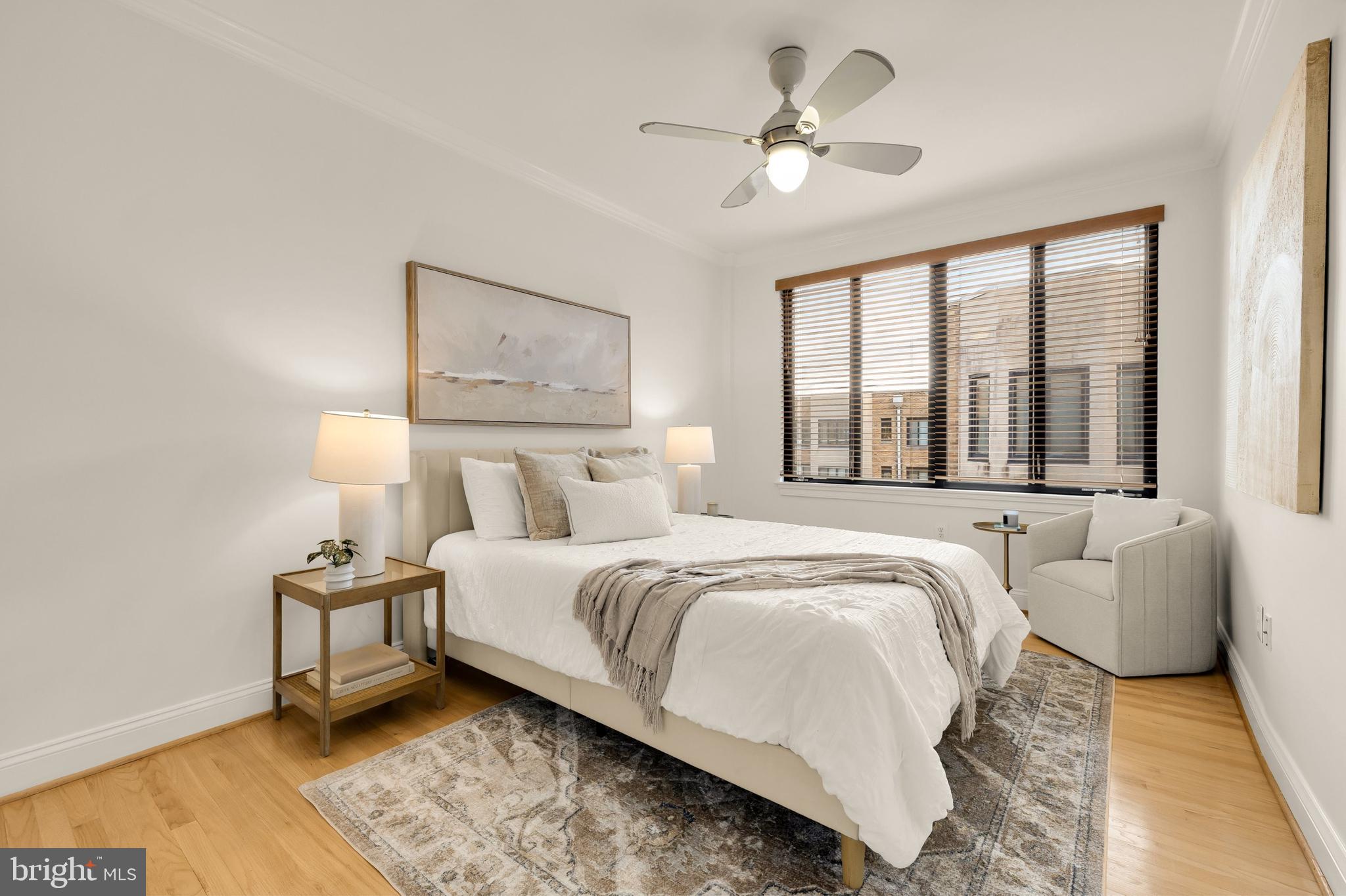 1701 16th Street Northwest, Unit 822 Washington, DC 20009 - Photo 9 of 19 a bedroom with bed and a large window