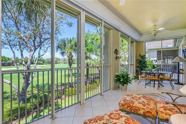 an aerial view of residential houses with outdoor space and street view