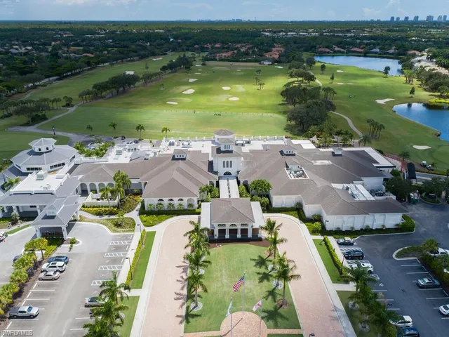 an aerial view of residential houses with outdoor space and river