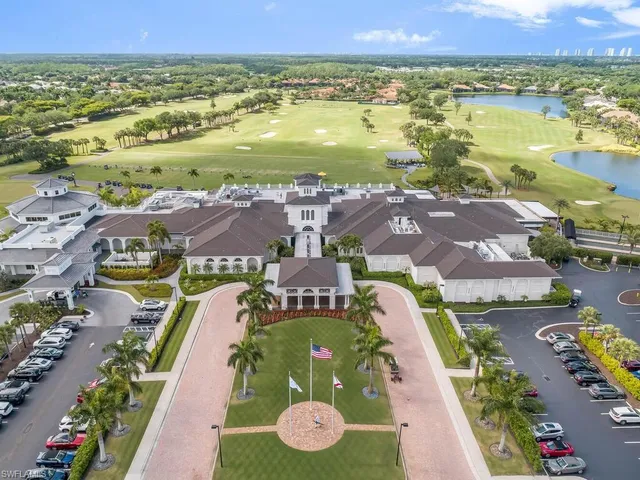 an aerial view of residential houses with outdoor space and river