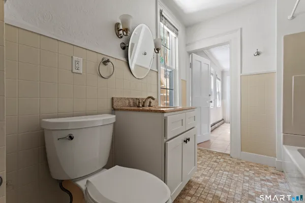 a bathroom with a toilet a sink and a shower