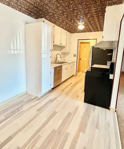 a view of kitchen with wooden floor