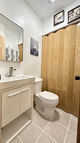 a bathroom with a sink toilet and vanity